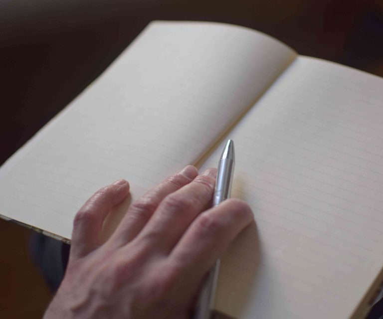 Notizbuch in Coachingsession